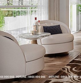 2 beige arm chairs with coffee table